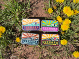 Cuchara Mountain Park sticker, Colorado ski area decal, waterproof vinyl sticker, dishwasher safe decal, water bottle sticker, Cuchara Colorado souvenir, mountain sunburst sticker, Colorado hiking gift, Southern Colorado merch, Spanish Peaks Colorado, hidden spoon design, 10810 elevation mountain, outdoor adventure sticker, laptop decal, retro Colorado mountain art, durable car bumper sticker, Colorado ski resort souvenir, Cuchara Mountain Park merch