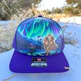 Vikings Football, Northern lights, viking trucker hat, snowy mountains, hand painted trucker hat, custom painted hat, Minnesota football fan gear, Norse mythology art, wearable art cap, Richardson 112 custom, hand painted viking, aurora borealis hat, winter mountain landscape art, custom snapback hat, unique football fan gifts, hand painted headwear, viking warrior art, custom apparel design
