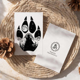 Wolf Paw Greeting Card: features a wolf paw with a wolf howling at a full moon with a hidden big & little dipper; wolf howling at the moon, colorado mountains, constellation, big dipper and little dipper constellation, wolf silhouette, wolf paw silhouette, wolf footprint silhouette, Wolf Paw Silhouette Greeting Card, Wolf Paw Silhouette card