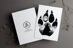 Wolf Paw Greeting Card: features a wolf paw with a wolf howling at a full moon with a hidden big & little dipper; wolf howling at the moon, colorado mountains, constellation, big dipper and little dipper constellation, wolf silhouette, wolf paw silhouette, wolf footprint silhouette, Wolf Paw Silhouette Greeting Card, Wolf Paw Silhouette card