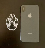 Wolf paw with mountains and full moon.  Sticker, wolf paw sticker, wolf paw silhouette sticker, wolf silhouette sticker, paw sticker, wolf howling at full moon sticker