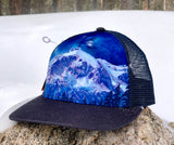 Vail mountain hat, galaxy trucker hat, Colorado mountain hats, limited edition trucker hat, cosmic snapback hat, outdoor adventure headwear, hidden visor art hat, mountain landscape trucker hat, galaxy fine art hat, wearable art snapback, sublimated visor hat, celestial mountain apparel, unique graphic trucker hats, cosmic wilderness hat, Vail Colorado souvenirs, Rocky Mountain trucker hat, Colorado lifestyle apparel, Vail ski resort hats, aprés ski snapback hat, alpine sunrise headwear, gifts for mountain 