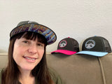 Elevation Addict Hat with Colorful Aspen art under the bill; Are you an elevation addict? This hat is for you, line art telluride hat, colorful aspen stand, aspen hat, colorado rockies hat, line art mountain hat, colorado hat, mountain trucker hat, colorado trucker hat, line art trucker hat