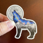 Wolf howling at a full moon with Galaxy inside and Maroon Bells mountain range in Aspen. wolf sticker, wolf galaxy sticker, wolf silhouette sticker, wolf full moon sticker, galaxy sticker, full moon sticker, Maroon Bells sticker, Aspen Sticker, Dog Sticker