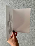 Wolf Paw Greeting Card: features a wolf paw with a wolf howling at a full moon with a hidden big & little dipper; wolf howling at the moon, colorado mountains, constellation, big dipper and little dipper constellation, wolf silhouette, wolf paw silhouette, wolf footprint silhouette, Wolf Paw Silhouette Greeting Card, Wolf Paw Silhouette card