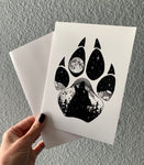 Wolf Paw Greeting Card: features a wolf paw with a wolf howling at a full moon with a hidden big & little dipper; wolf howling at the moon, colorado mountains, constellation, big dipper and little dipper constellation, wolf silhouette, wolf paw silhouette, wolf footprint silhouette, Wolf Paw Silhouette Greeting Card, Wolf Paw Silhouette card